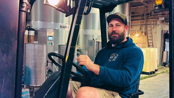 Nine Pin's cider maker Jake driving a forklift